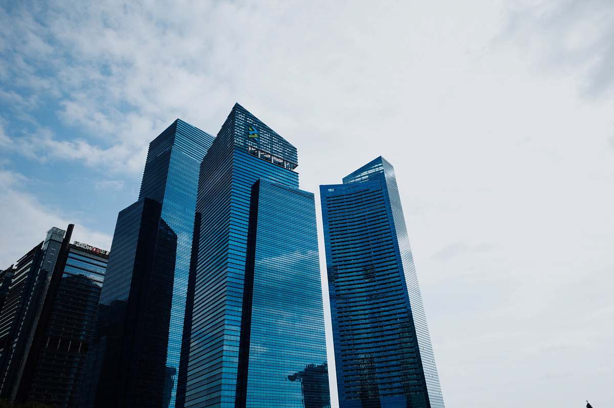 office building low-angle photo of high-rise building during daytime city